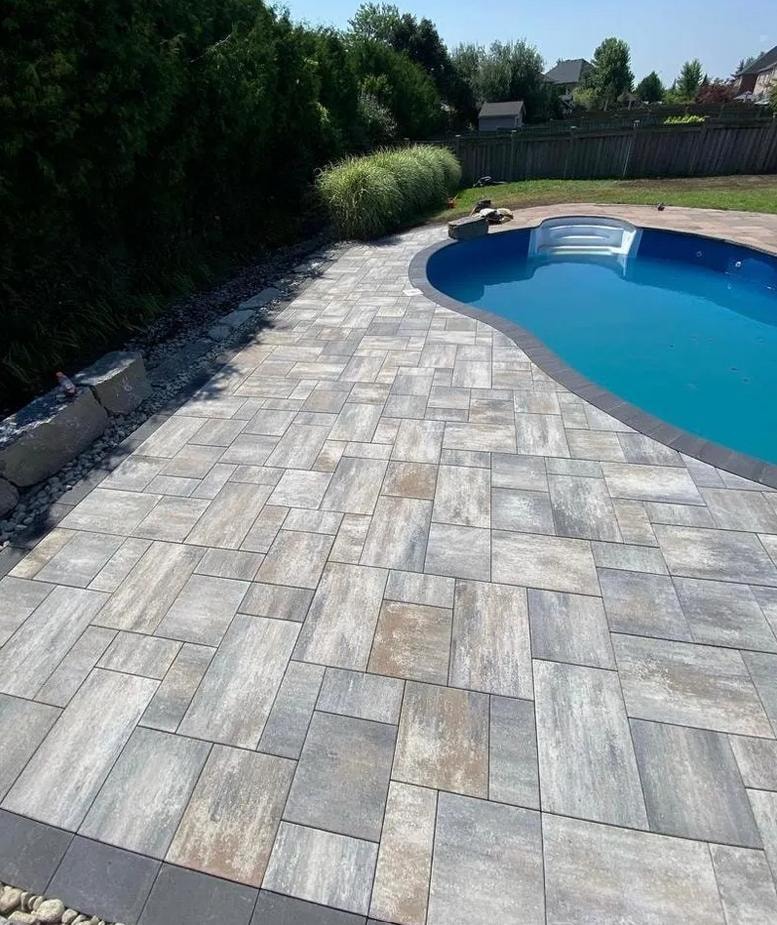 Poolside hardscaping and interlock patio project by BCI Landscaping